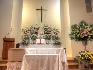 casket at front of church